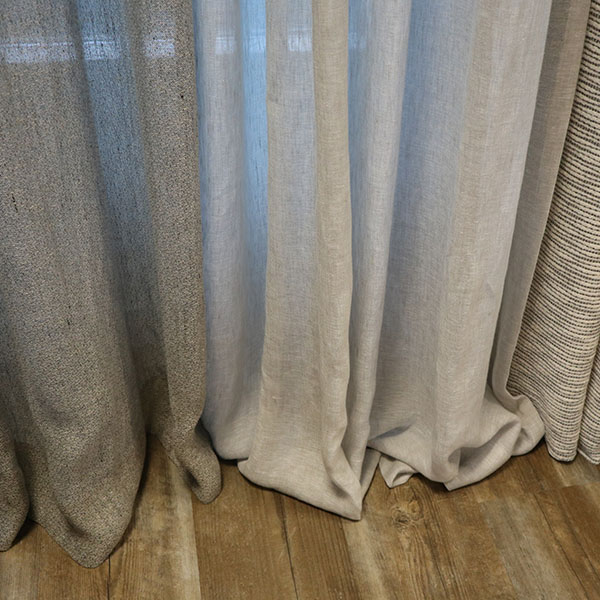 Foto van natuurlijke stoffen zoals wol, linnen en katoen. Een heel eigen karakter